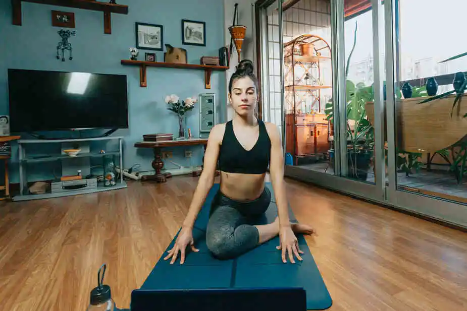 Woman Sits In A Yoga Pose